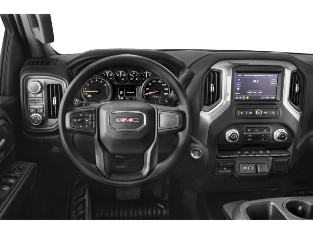 GMC Sierra 3500 HD car interior showing dashboard, steering wheel, and large central touchscreen display.