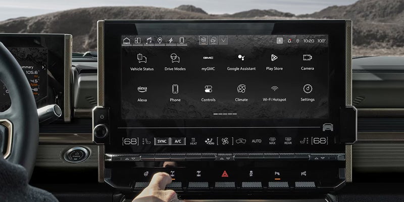 GMC Hummer-EV-SUV model showing dashboard, steering wheel, and large central touchscreen display.
